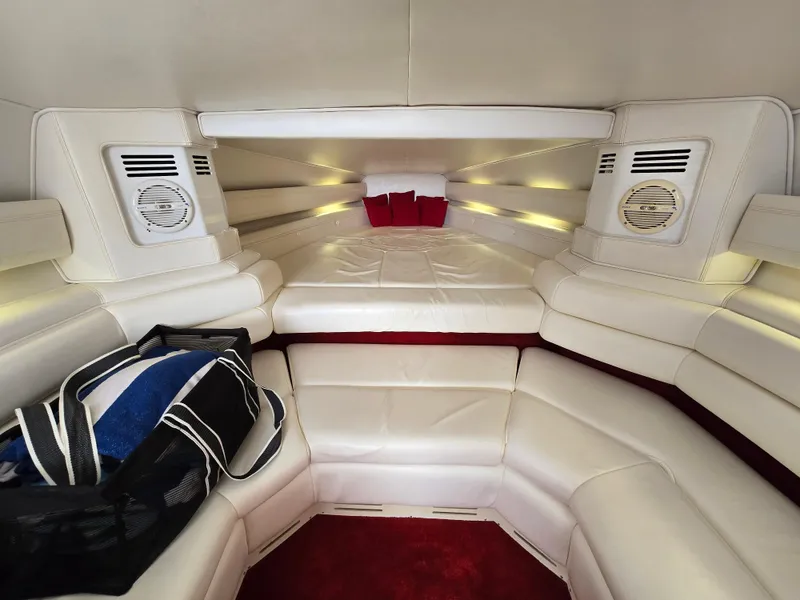 Slide: The Image of Interior of 1995 Fountain 38 Sport Cruiser with white leather seating and red accents. - 36