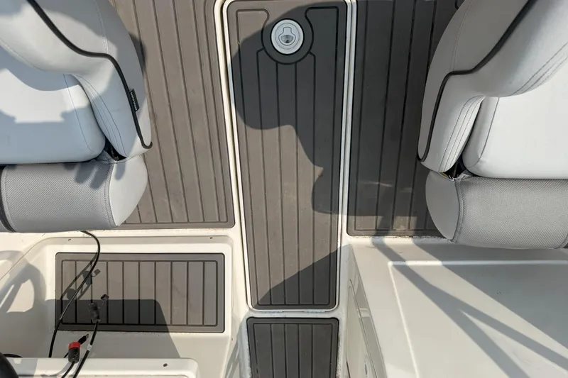 Slide: The Image of 2022 Bayliner VR4 Bowrider I/O interior with gray seating and deck flooring. - 11