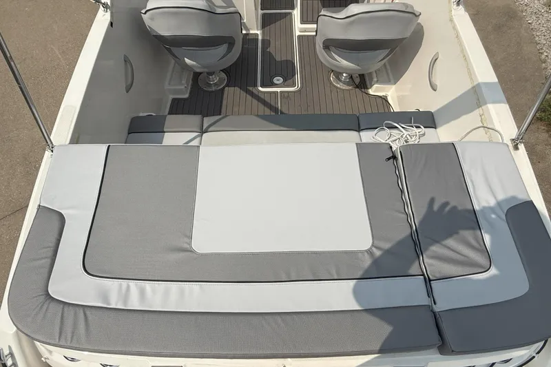 Slide: The Image of 2022 Bayliner VR4 Bowrider I/O interior with gray seating and deck view. - 6