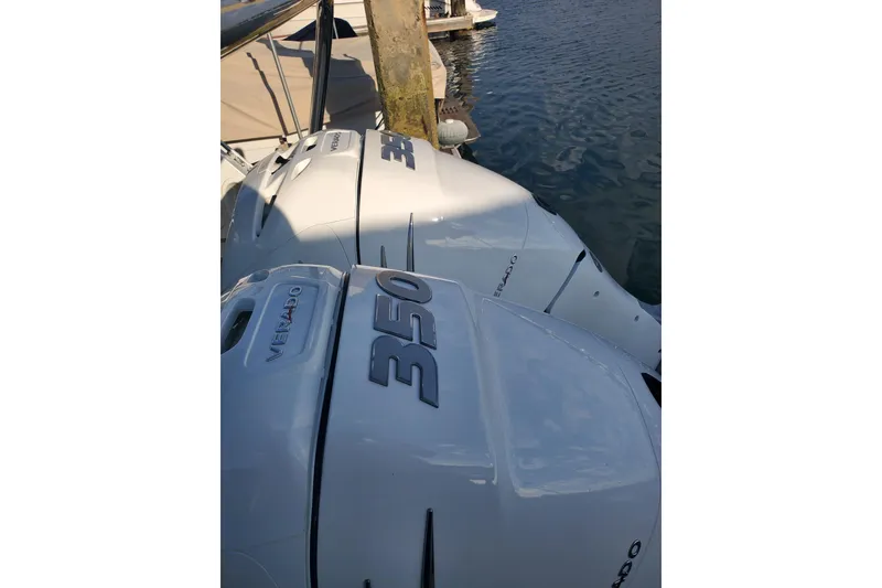 Slide: The Image of Twin 350 Verado engines on a 2021 Beneteau Flyer 10 at the dock. - 22