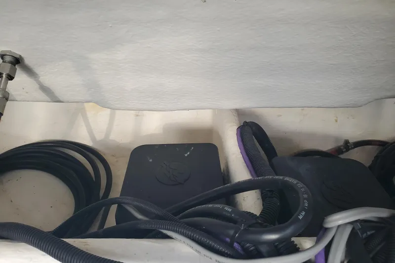 Slide: The Image of 2021 Beneteau Flyer 10 engine compartment with cables and components. - 24