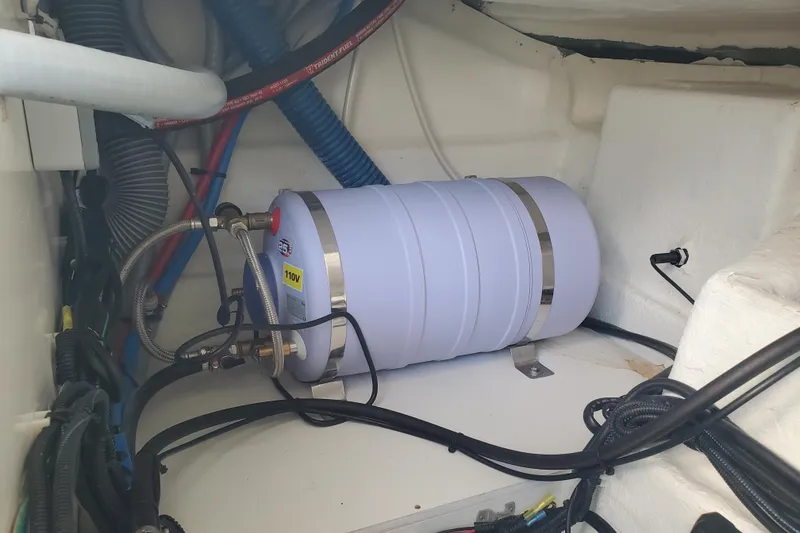 Slide: The Image of Engine compartment of 2021 Beneteau Flyer 10 with water heater and wiring. - 25