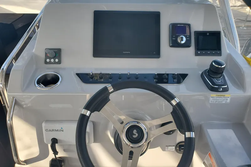 Slide: The Image of 2021 Beneteau Flyer 10 helm with Garmin navigation and control systems. - 4
