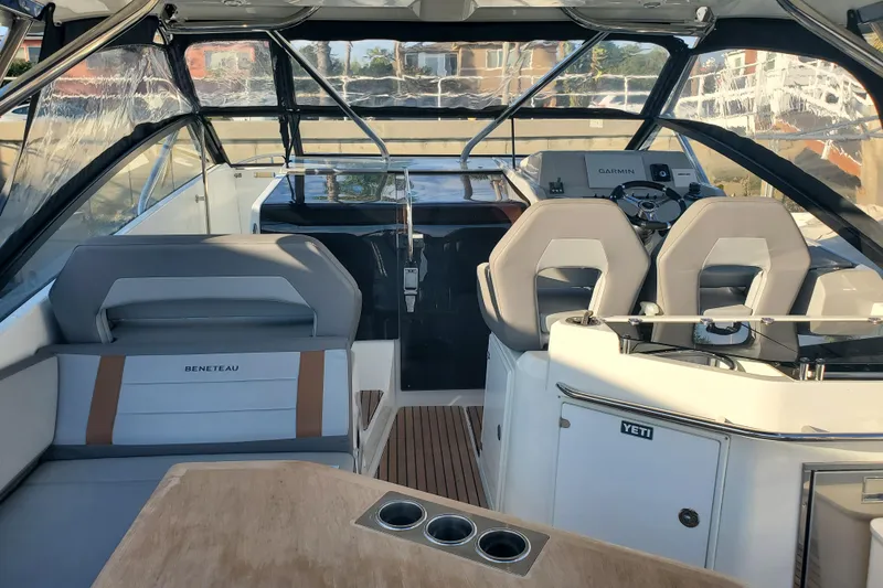 Slide: The Image of Interior of 2021 Beneteau Flyer 10 boat with seating and helm, featuring modern design. - 5
