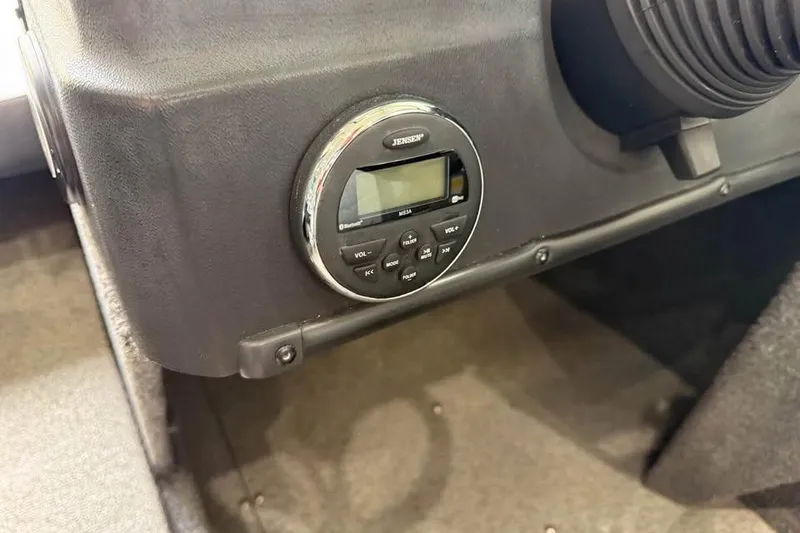 Slide: The Image of 2017 Lowe Fish & Ski 1710 boat dashboard with Jensen audio system. - 12