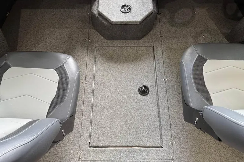 Slide: The Image of 2017 Lowe Fish & Ski 1710 boat interior with gray seating and carpeted floor. - 13