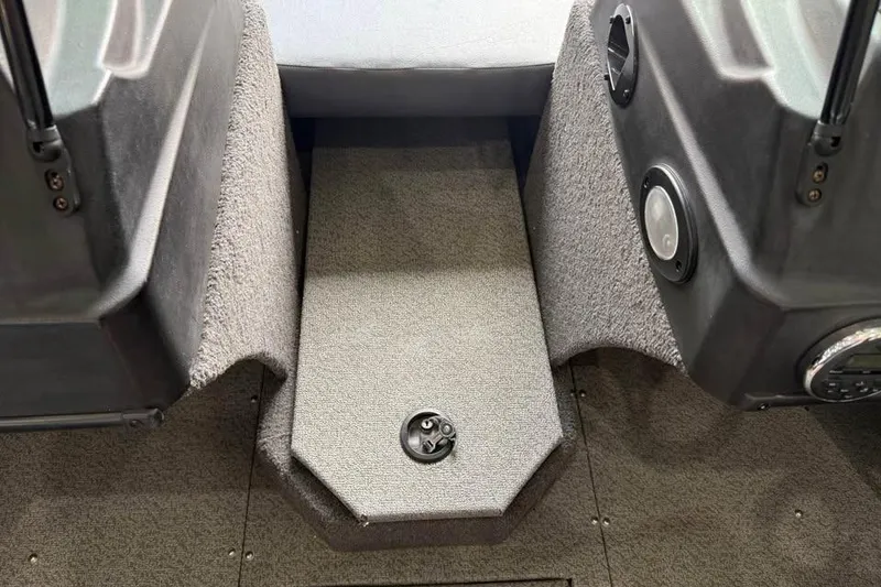 Slide: The Image of 2017 Lowe Fish & Ski 1710 interior with carpeted flooring and speaker system. - 14