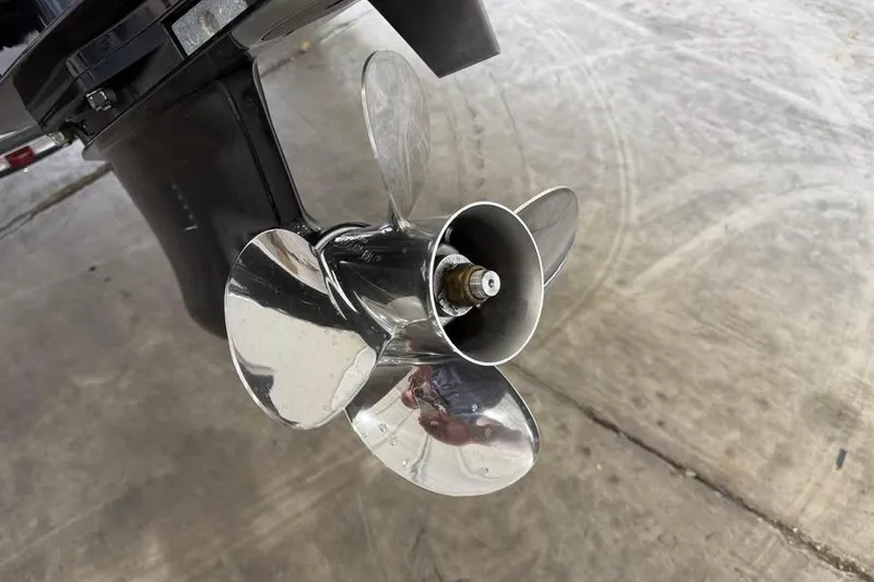 Slide: The Image of 2017 Lowe Fish & Ski 1710 boat propeller on concrete surface. - 17