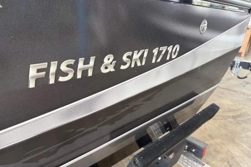 Slide: The Image of 2017 Lowe Fish & Ski 1710 boat, close-up of model name on hull. - 18