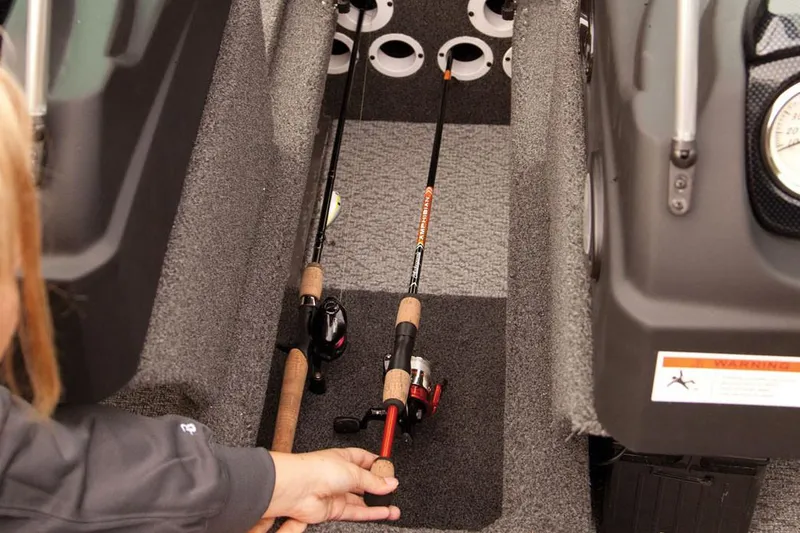 Slide: The Image of Manufacturer Provided Image: 2017 Lowe Fish & Ski FS1710 boat interior with fishing rods. - 24