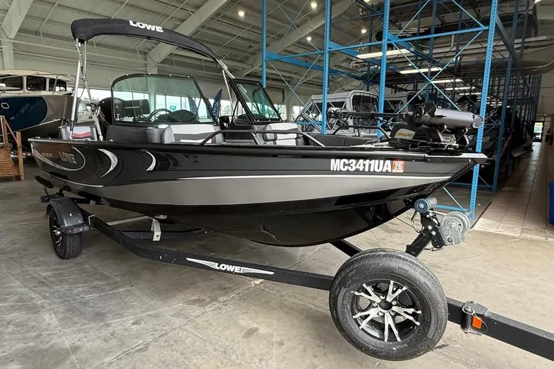 Slide: The Image of 2017 Lowe Fish & Ski 1710 boat on trailer in indoor storage facility. - 5