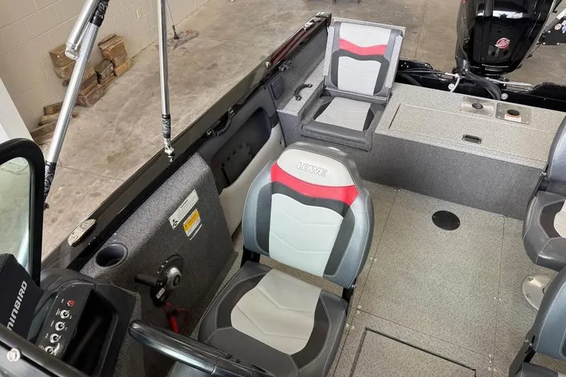 Slide: The Image of 2017 Lowe Fish & Ski 1710 boat interior with seating and control panel. - 7