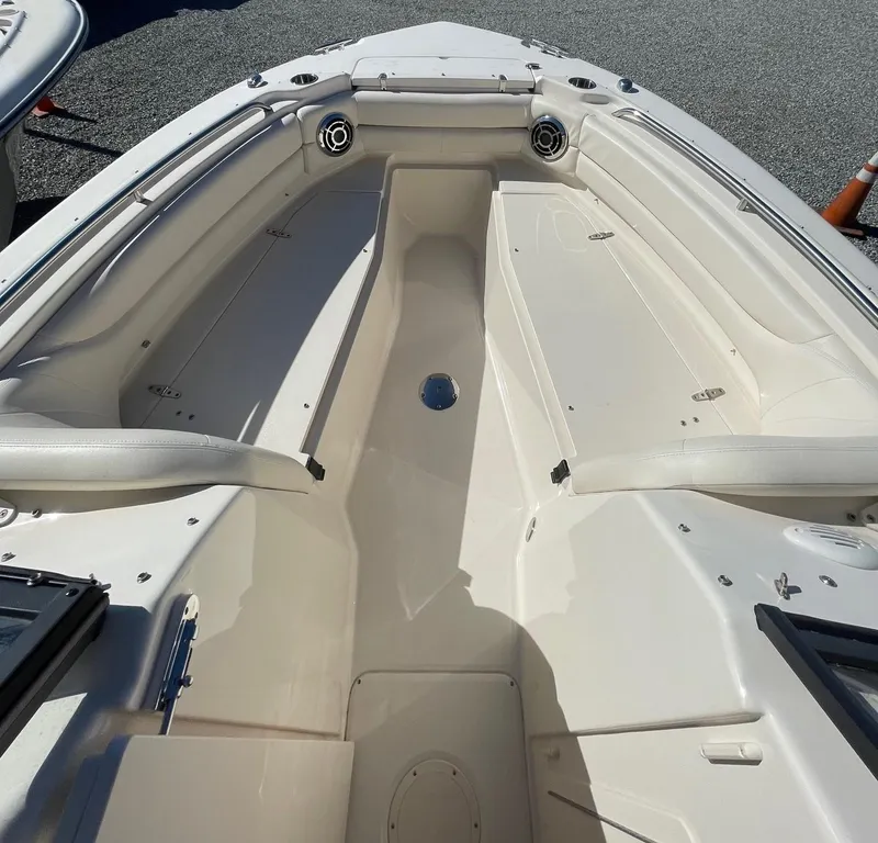 Slide: The Image of 2015 Grady-White Freedom 255 boat interior with spacious seating and storage compartments. - 13