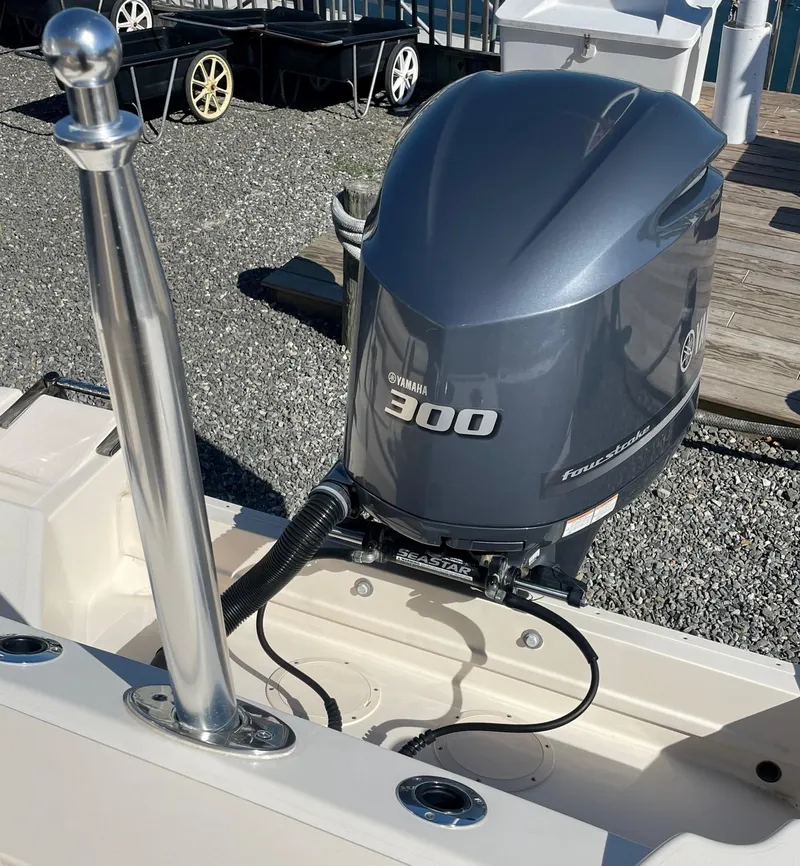 Slide: The Image of 2015 Grady-White Freedom 255 boat with Yamaha 300 engine at dock. - 22