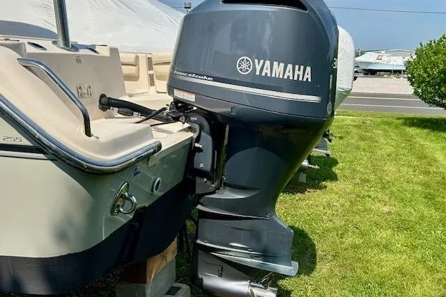 Slide: The Image of 2015 Grady-White Freedom 255 boat with Yamaha outboard motor on grass. - 23