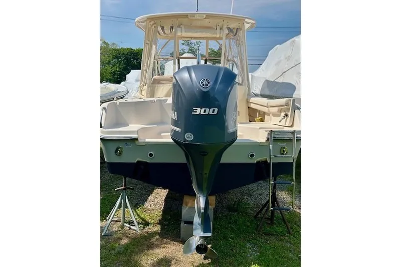 Slide: The Image of 2015 Grady-White Freedom 255 boat with Yamaha 300 outboard motor, parked on stands. - 24