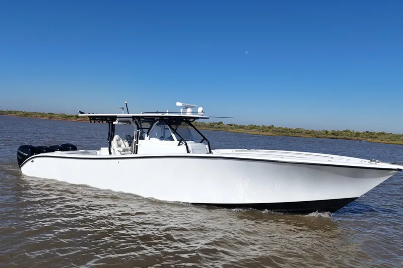 Slide: The Image of 2016 Yellowfin 42 Offshore boat cruising on a sunny day. - 19