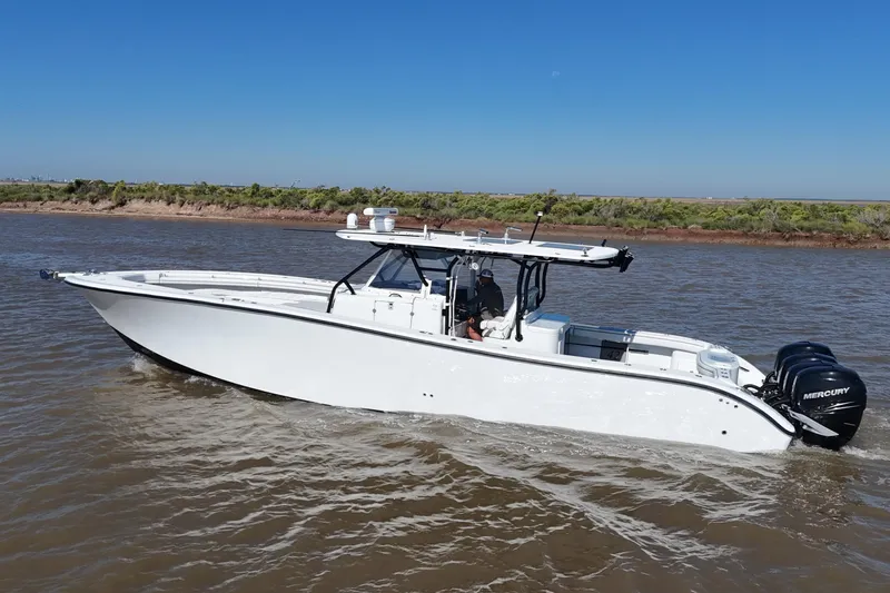 Slide: The Image of 2016 Yellowfin 42 Offshore boat cruising on a sunny day with clear blue skies. - 22