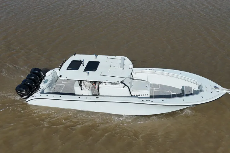 Slide: The Image of 2016 Yellowfin 42 Offshore boat cruising on water, featuring multiple outboard engines. - 3