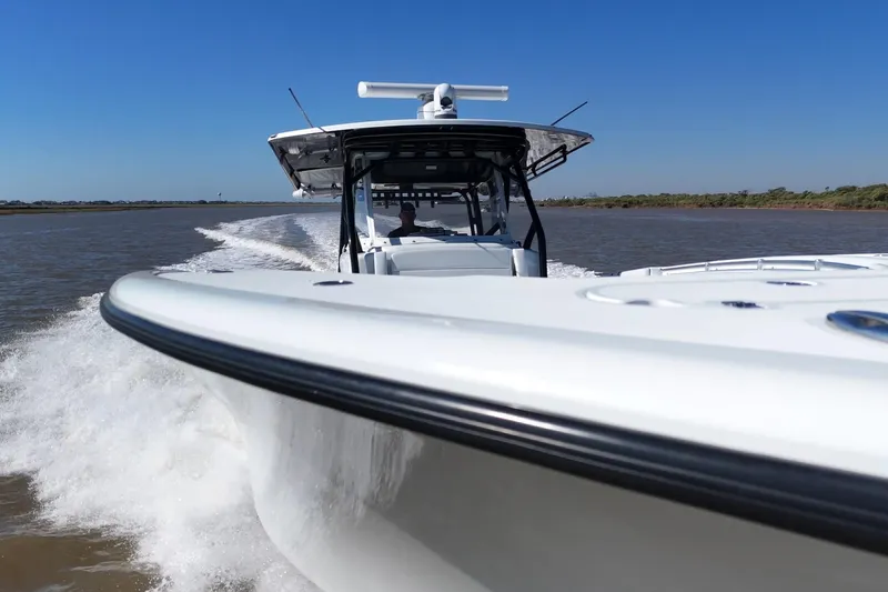 Slide: The Image of 2016 Yellowfin 42 Offshore boat cruising on a sunny day. - 33