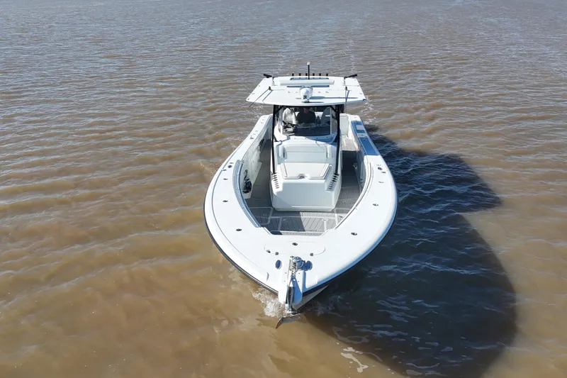 Slide: The Image of 2016 Yellowfin 42 Offshore boat cruising on calm waters. - 5