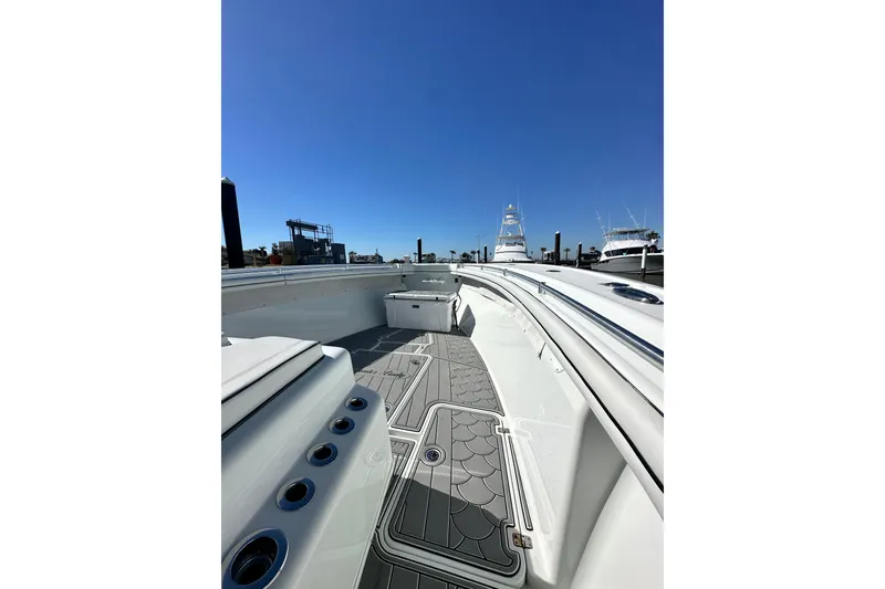 Slide: The Image of 2016 Yellowfin 42 Offshore boat deck with clear blue sky background. - 55