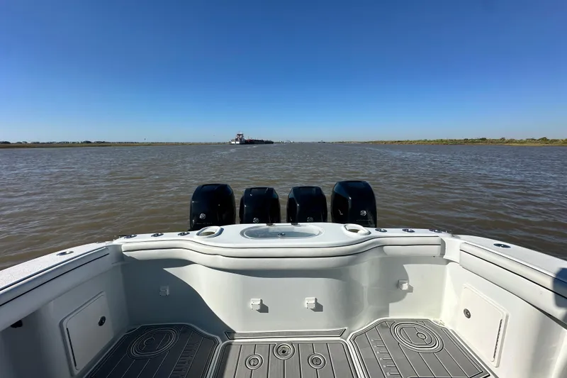 Slide: The Image of 2016 Yellowfin 42 Offshore boat with four engines on open water. - 59