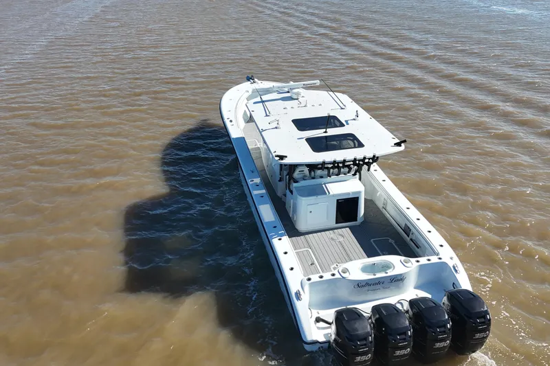 Slide: The Image of 2016 Yellowfin 42 Offshore boat with four engines on open water. - 6