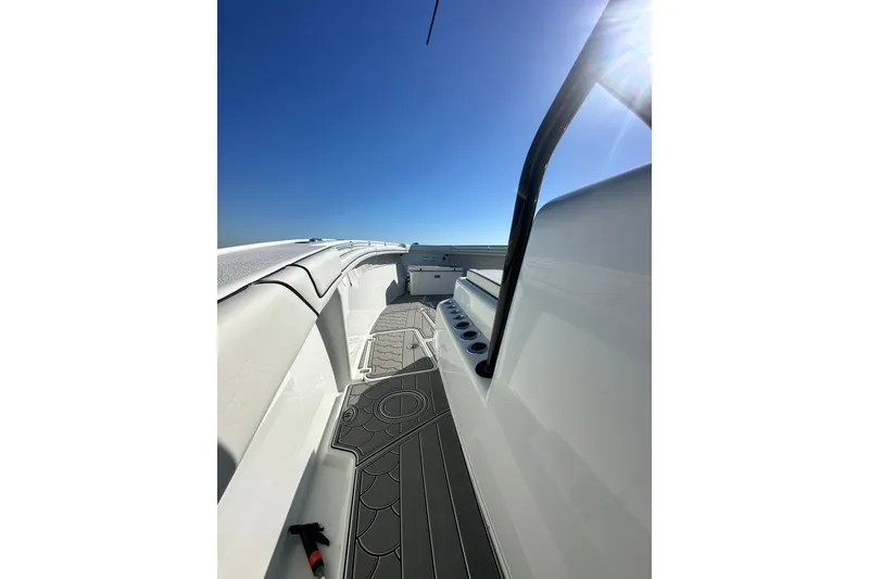 Slide: The Image of 2016 Yellowfin 42 Offshore boat deck under clear blue sky. - 66
