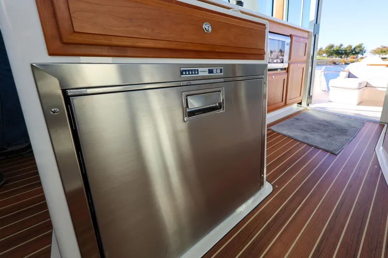 Slide: The Image of 2024 Back Cove 39O stainless steel fridge under helm seats - 25