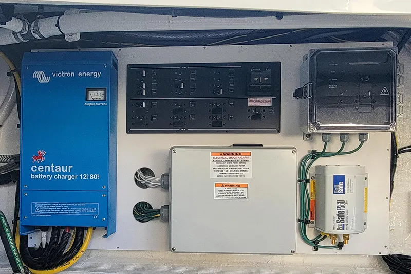 Slide: The Image of Electrical panel of 2024 Back Cove 39O with Victron Energy battery charger. - 33