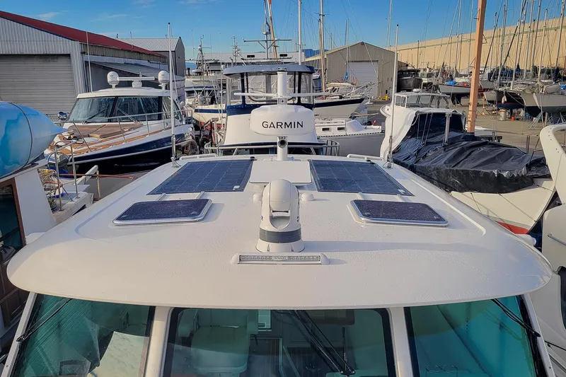 Slide: The Image of 2024 Back Cove 39O boat with solar panels, forward facing flood light and Garmin radar - 39