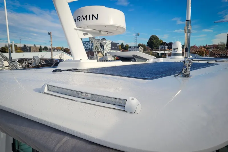 Slide: The Image of 2024 Back Cove 39O with Garmin radar, solar panel and starboard aft facing floodlight - 40