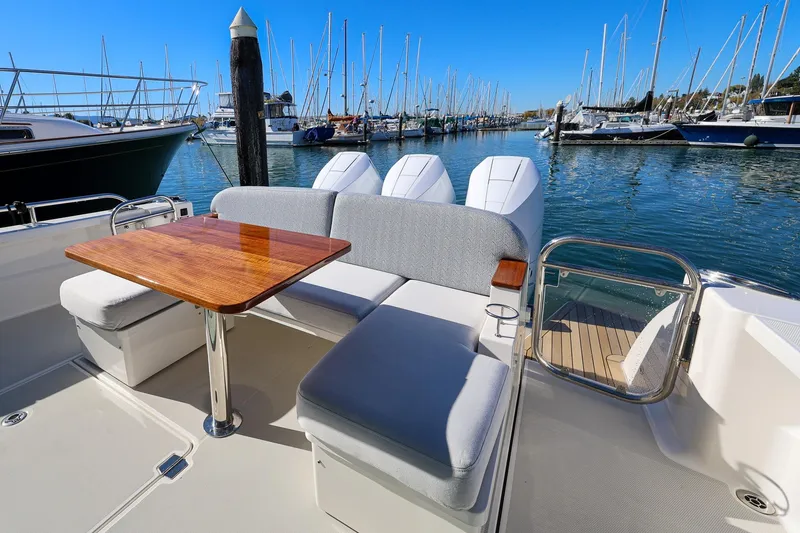 Slide: The Image of 2024 Back Cove 39O Cockpit seating and wooden table - 7