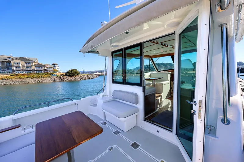 Slide: The Image of 2024 Back Cove 39O yacht with spacious deck and modern interior design. - 9
