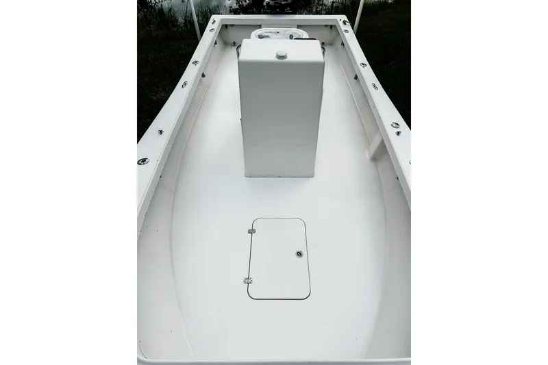 Slide: The Image of 2024 Hanson 23 boat interior with white deck and central console. - 10