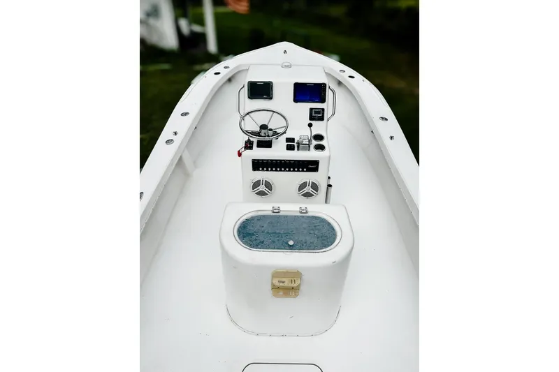 Slide: The Image of 2024 Hanson 23 boat cockpit with steering wheel and control panel. - 3