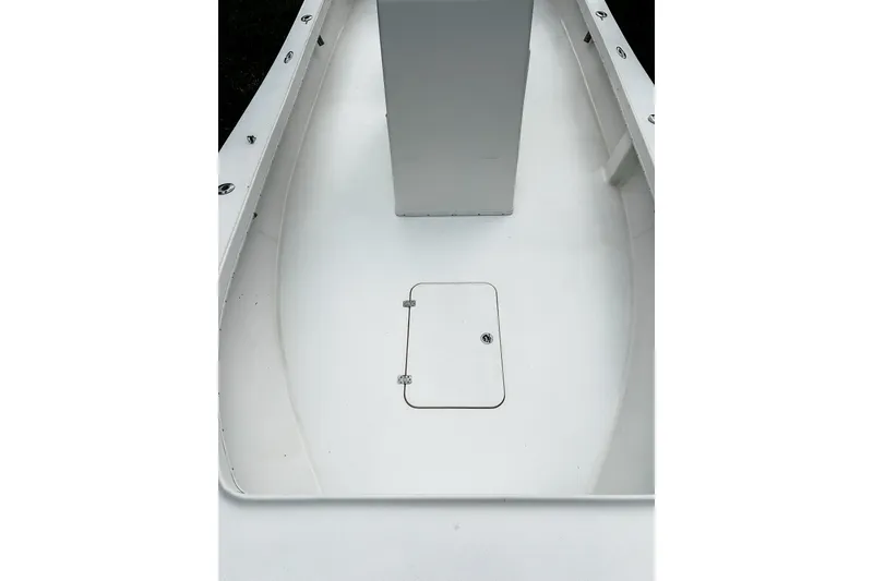 Slide: The Image of 2024 Hanson 23 boat deck with storage hatch, sleek white design. - 9
