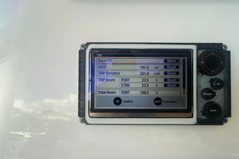 Slide: The Image of Display screen of a 2015 Century 2901 Center Console showing trip data and settings. - 15