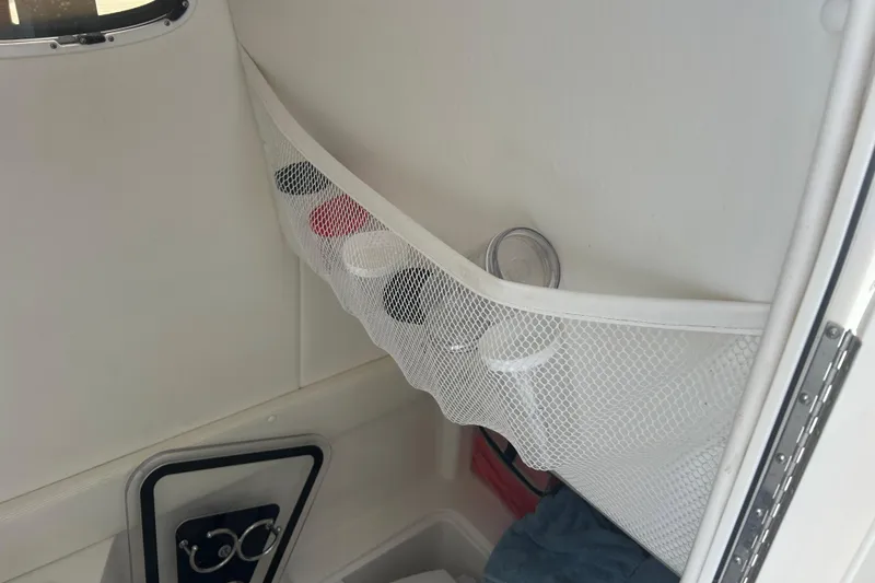 Slide: The Image of Interior of 2015 Century 2901 Center Console with net storage and accessories. - 18