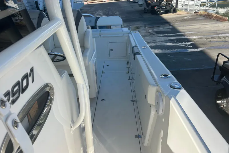 Slide: The Image of 2015 Century 2901 Center Console boat interior, featuring sleek white design and spacious layout. - 24