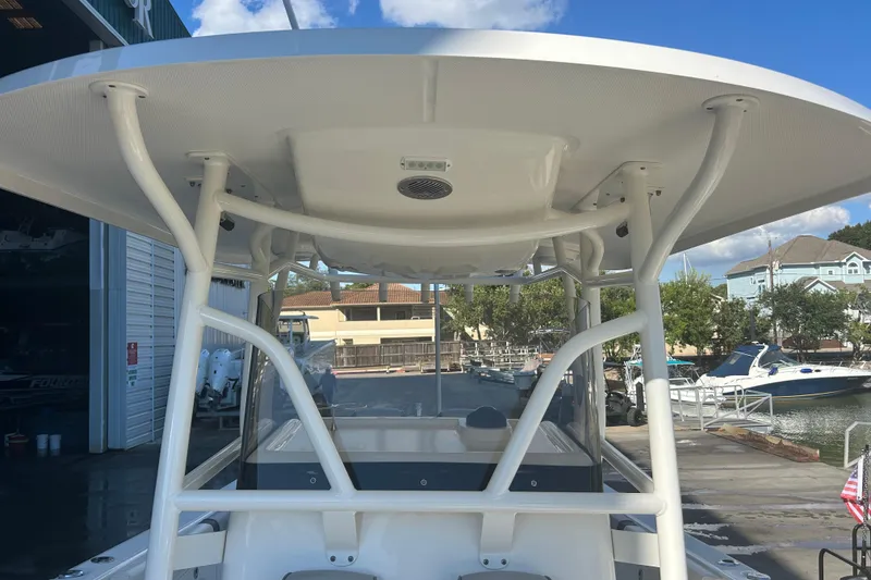 Slide: The Image of 2015 Century 2901 Center Console boat with T-top, docked at marina. - 27