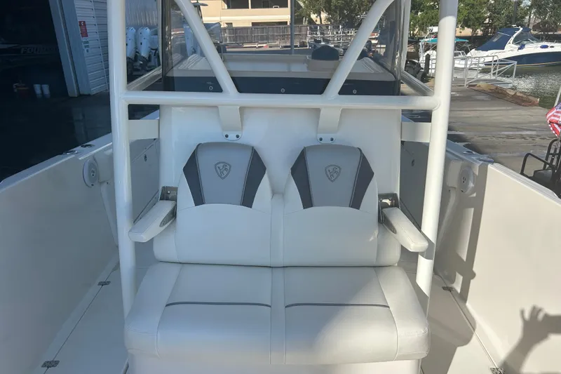 Slide: The Image of 2015 Century 2901 Center Console boat with dual cushioned seats and sturdy frame. - 28