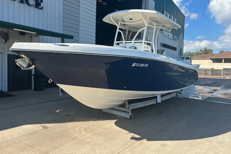 Slide: The Image of 2015 Century 2901 Center Console boat on display outside a building. - 3