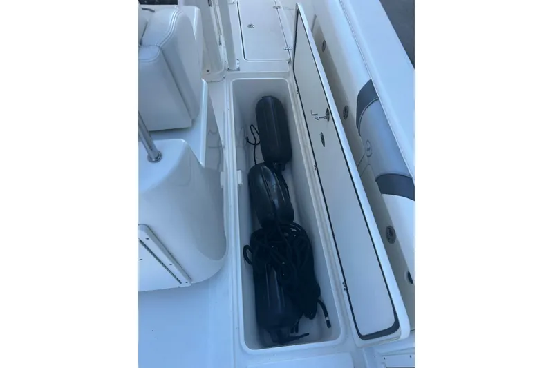 Slide: The Image of 2015 Century 2901 Center Console boat storage compartment with fenders and ropes. - 39