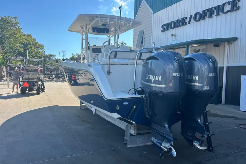 Slide: The Image of 2015 Century 2901 Center Console boat with twin Yamaha 300 engines at marina. - 40