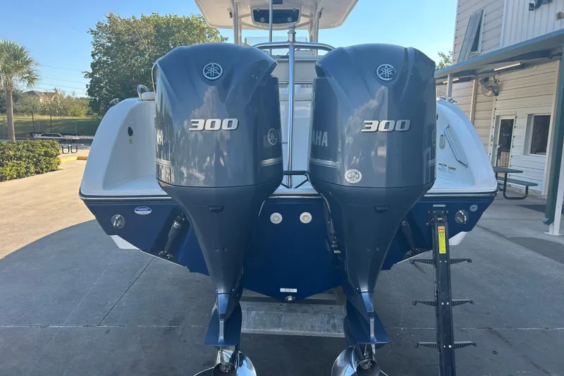Slide: The Image of 2015 Century 2901 Center Console with twin Yamaha 300 engines, docked outdoors. - 41
