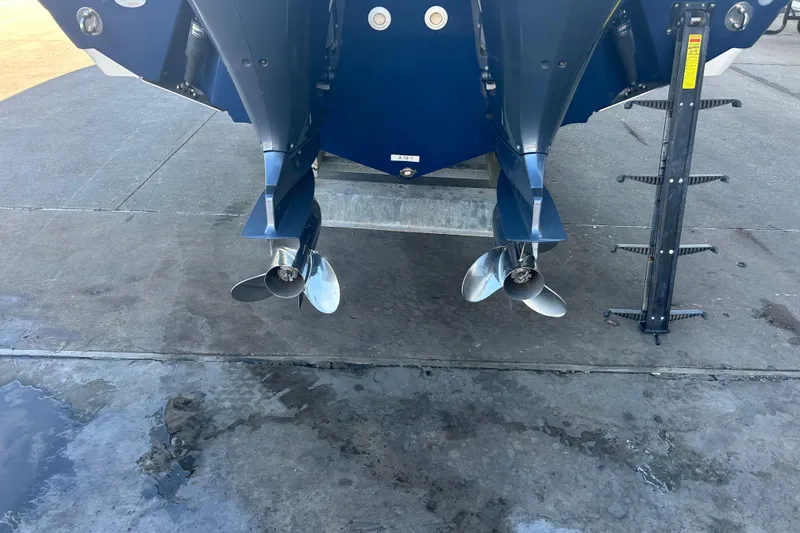 Slide: The Image of Dual propellers on a 2015 Century 2901 Center Console boat, dockside view. - 42