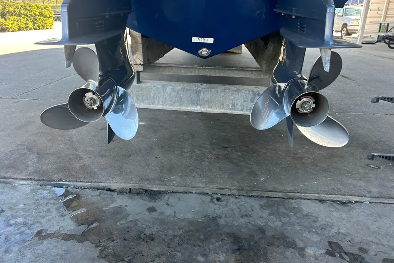 Slide: The Image of 2015 Century 2901 Center Console boat propellers on a concrete surface. - 43