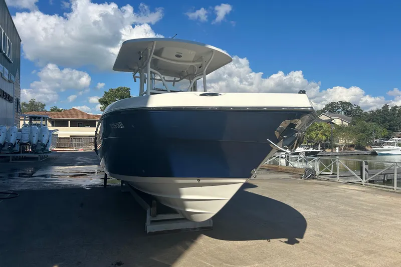 Slide: The Image of 2015 Century 2901 Center Console boat on a sunny dockside. - 5